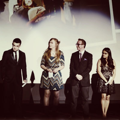 A group of students discuss their film on stage at the Blue and White Film Festival