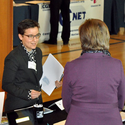 A student discusses career possibilities with a recruiter at a communications-specific career fair