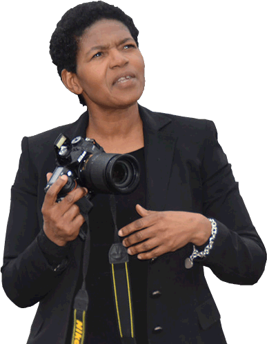 Faculty Renea Nichols holding a DSLR camera