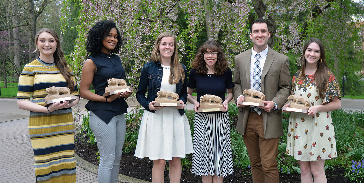 Student marhsalls pose with lion shrine awards