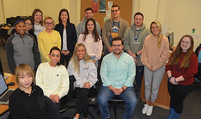 A group of fifteen students from a 400-level public relations campaigns class poses together after driving drove Penn State’s first entry in a national contest sponsored by PRWeek.