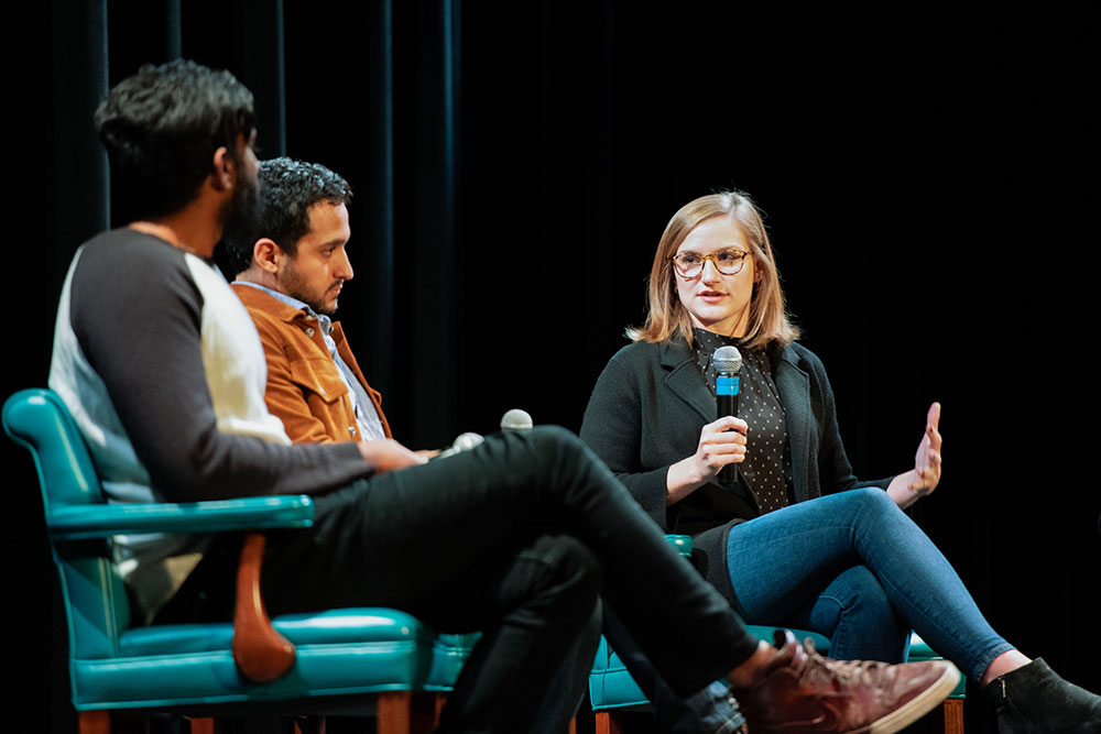 Student moderating a panel discussion