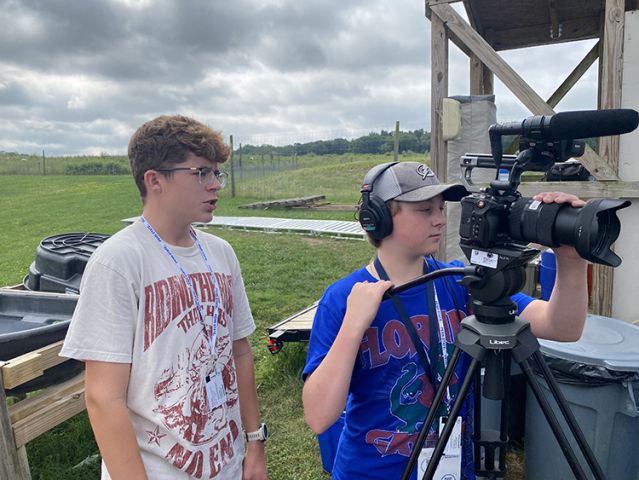 Two boys at camera.