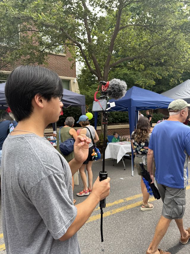 Student with camera and mic