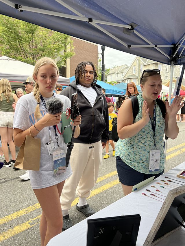 Three students facing camera