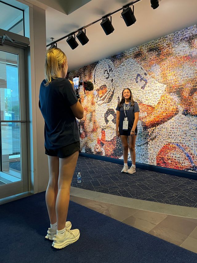 A picture in front of the mural.