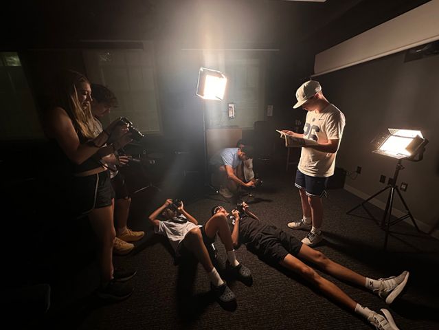 Testing light in dark room.