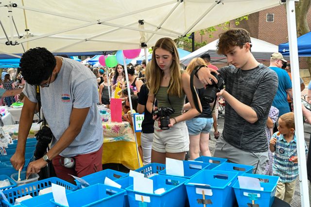 Three students getting upclose shots