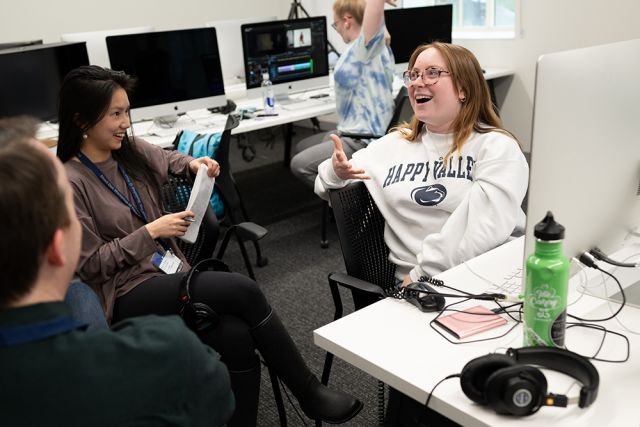 An alumna instructing a student