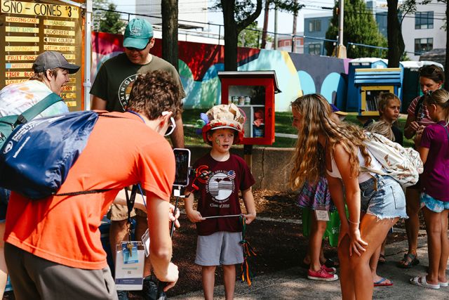 Campers record a young student.