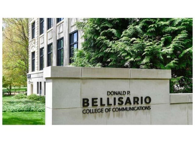 Stone sign displaying name of building "Donald P. Bellisario College of Communications"