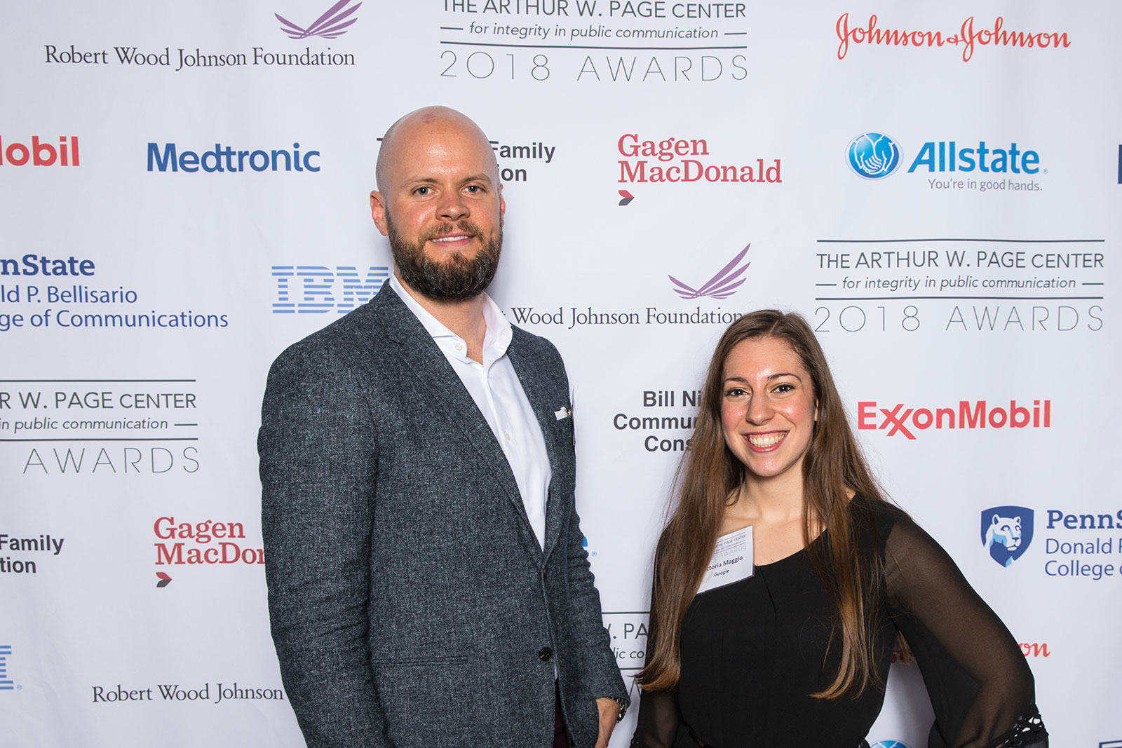 Event volunteers and Penn State alumni Jeremy Smith and Victoria Maggio smile for the camera.