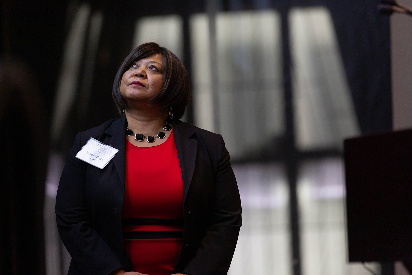 Sandra Clark watches the tribute video for honoree Dean Baquet. 