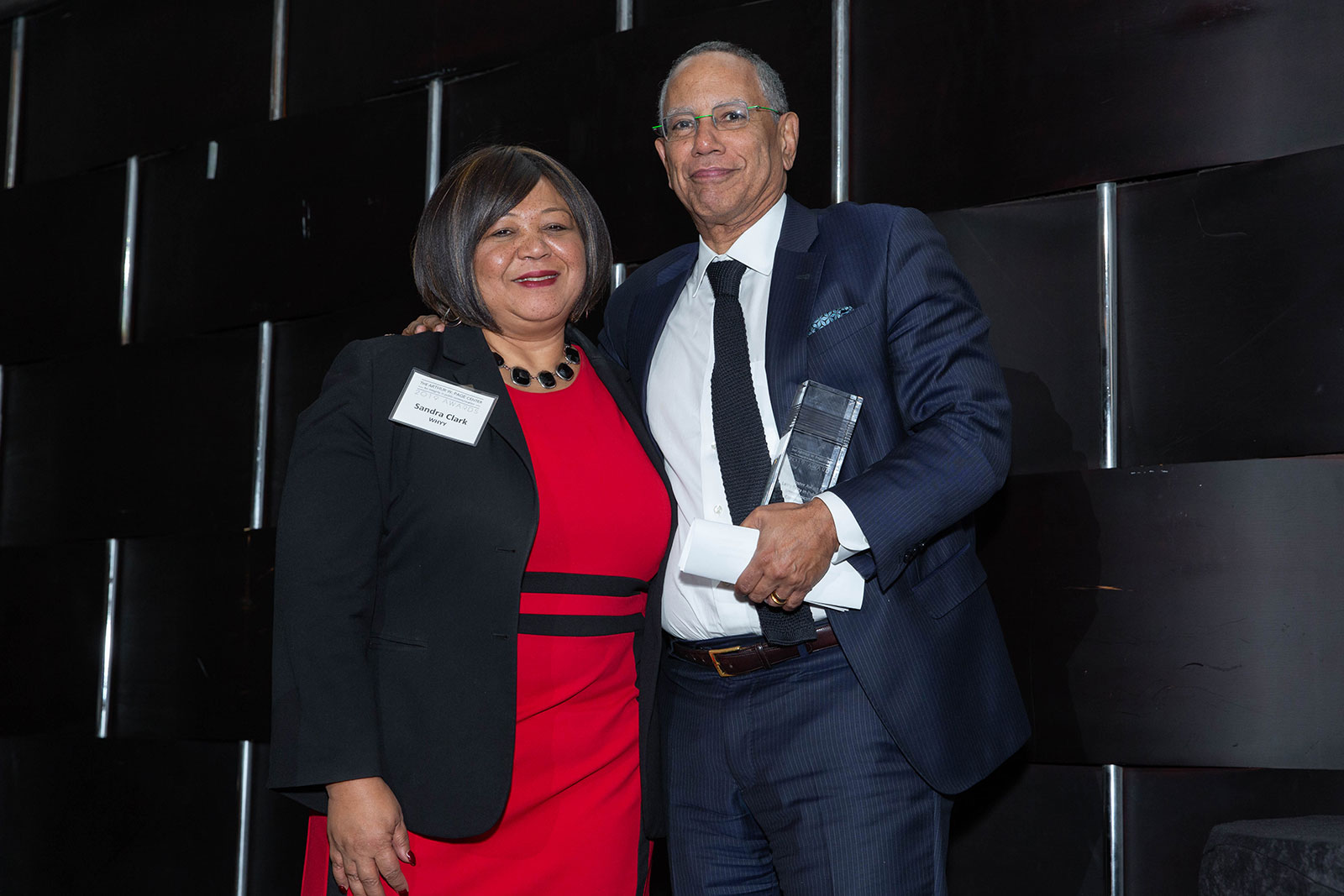 Sandra Clark and honoree Dean Baquet pose for a photo after Baquet's acceptance speech.
