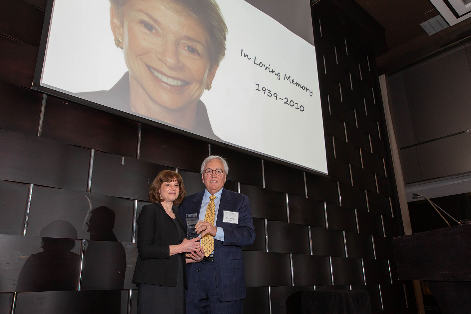 Lisa Pott (Laurie's daughter) and Dick Martin pose with Laurie's 2019 Larry Foster Award.