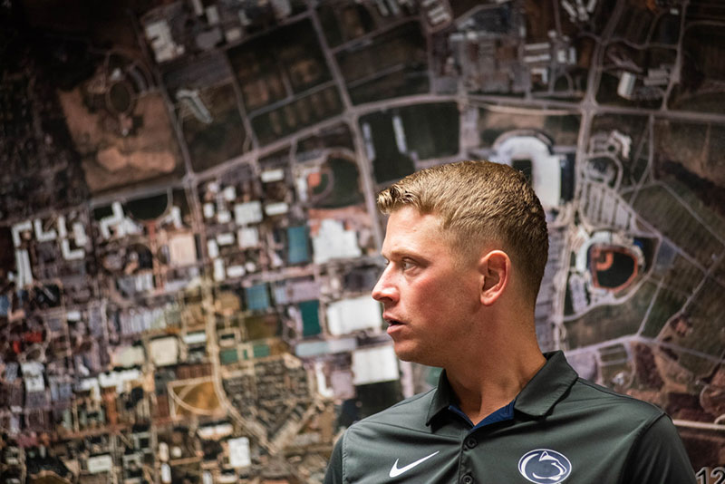 Penn State's grounds supervisor talks to his team prior to a game.