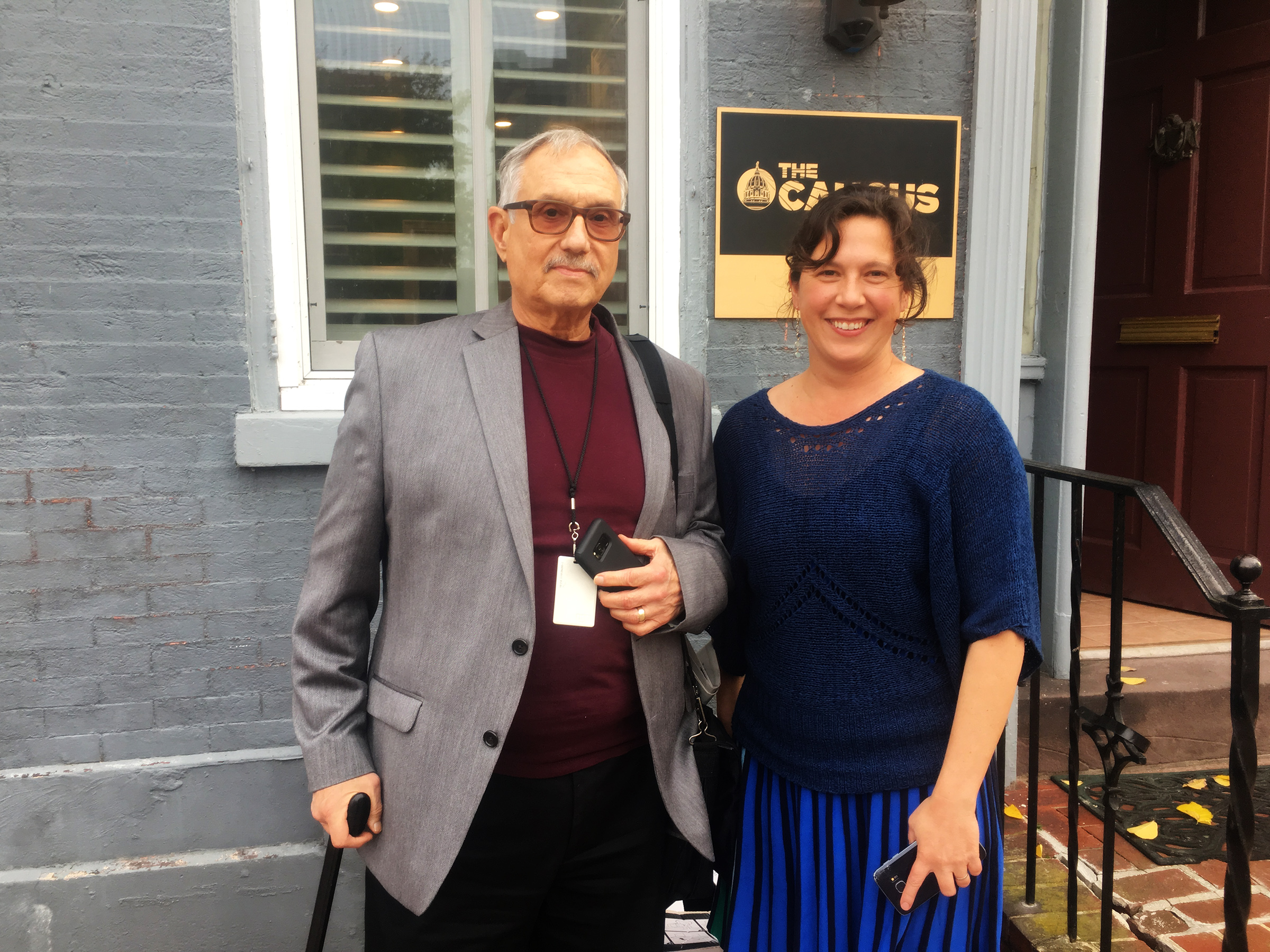 Brad Bumsted, bureau chief of a Pennsylvania watchdog publication called The Caucus with Caucus poses with investigative reporter Paula Knudsen in front of the Caucuses' office building.